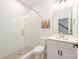 Bathroom featuring a glass-enclosed shower, toilet, vanity and whimsical artwork on the wall at 2558 Deacon Ave, Charlotte, NC 28204