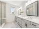 Bright bathroom with double vanities, a glass-enclosed shower, and sleek, modern design at 2558 Deacon Ave, Charlotte, NC 28204