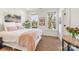 Bright bedroom showcasing hardwood floors, natural light, and stylish decor at 2558 Deacon Ave, Charlotte, NC 28204