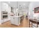 Spacious kitchen with a large center island, stainless steel appliances and hardwood floors at 2558 Deacon Ave, Charlotte, NC 28204