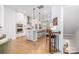 Bright open kitchen boasts a spacious island, stainless steel appliances, and light hardwood flooring at 2558 Deacon Ave, Charlotte, NC 28204