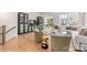 Open-concept living room with hardwood floors, comfortable seating, and large windows for natural light at 2558 Deacon Ave, Charlotte, NC 28204