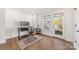 Office with modern desk, hardwood floors, outside balcony access, and large windows at 2558 Deacon Ave, Charlotte, NC 28204