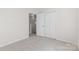 A serene bedroom showcasing a closet and an open doorway leading to another room at 2708 N Valley Ct, Charlotte, NC 28273