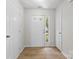 Inviting entryway showcasing a white front door with sidelight window and neutral flooring at 2708 N Valley Ct, Charlotte, NC 28273