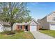 Charming two-story home with brick and vinyl siding and attached one car garage, nestled in a well-maintained yard at 2708 N Valley Ct, Charlotte, NC 28273