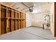 Partially finished garage with painted floors, overhead door, and plenty of storage space at 2708 N Valley Ct, Charlotte, NC 28273