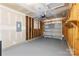 A spacious, unfinished garage featuring a roll-up door and ample room for parking and storage at 2708 N Valley Ct, Charlotte, NC 28273