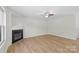 Spacious living room featuring wood flooring, fireplace, natural light, and modern design at 2708 N Valley Ct, Charlotte, NC 28273