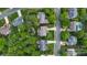 An aerial view of a suburban neighborhood with tree-lined streets and well-kept lawns at 2710 Providence Spring Ln, Charlotte, NC 28270