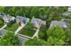 An aerial view of a lush home with a large manicured lawn and a mature tree at 2710 Providence Spring Ln, Charlotte, NC 28270