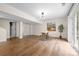Spacious basement with wood flooring, modern lighting, and French doors leading to the yard at 2710 Providence Spring Ln, Charlotte, NC 28270