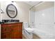 Traditional bathroom with dark wood vanity, black granite top, and a shower-tub combination at 2710 Providence Spring Ln, Charlotte, NC 28270