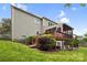 Exterior view of the home with a wooden deck and landscaped backyard at 2710 Providence Spring Ln, Charlotte, NC 28270