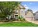 Charming home featuring brick and siding exterior, manicured landscaping, and a welcoming front entrance at 2710 Providence Spring Ln, Charlotte, NC 28270