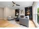 Cozy living room featuring built-in shelves, a fireplace, recessed lighting, and comfortable seating at 2710 Providence Spring Ln, Charlotte, NC 28270