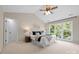 Relaxing main bedroom featuring plush carpet, a ceiling fan, and an abundance of natural light at 2710 Providence Spring Ln, Charlotte, NC 28270