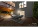 Back patio with stylish furniture, brick pavers, and views of the upper deck at 2710 Providence Spring Ln, Charlotte, NC 28270