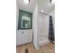 Bright bathroom features a modern vanity, green accent wall, and shower at 2822 Hugh Rd, Shelby, NC 28150