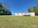 Charming single-story home with a front deck and spacious lawn at 2822 Hugh Rd, Shelby, NC 28150