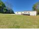 Single-story home with a welcoming front deck, set on a spacious green lawn at 2822 Hugh Rd, Shelby, NC 28150