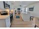 Modern kitchen with stainless steel appliances, white cabinets, and a stylish island at 2822 Hugh Rd, Shelby, NC 28150