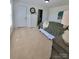Spacious bedroom with carpet flooring, a dresser, and ensuite bathroom entrance at 2822 Hugh Rd, Shelby, NC 28150