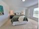 Bedroom with carpet flooring, a window, and a bed with nightstands at 2822 Hugh Rd, Shelby, NC 28150