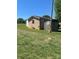 View of backyard featuring several outdoor buildings and structures at 28344 Canton Rd, Albemarle, NC 28001