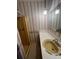 Bathroom features floral wallpaper, yellow shower stall, and an older vanity at 28344 Canton Rd, Albemarle, NC 28001