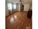 Bedroom boasts hardwood floors, a ceiling fan, and a fireplace for a cozy atmosphere at 28344 Canton Rd, Albemarle, NC 28001