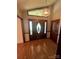 View of a formal foyer featuring hardwood floors and a front door with decorative sidelights at 28344 Canton Rd, Albemarle, NC 28001