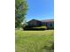 A cozy, well-maintained single-story brick home with a lush, green lawn at 28344 Canton Rd, Albemarle, NC 28001