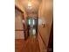 Hallway with traditional wood trim and wall paneling leading to the home's entrance at 28344 Canton Rd, Albemarle, NC 28001