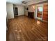 Spacious living room featuring hardwood floors and a decorative fireplace at 28344 Canton Rd, Albemarle, NC 28001
