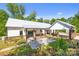 Aerial view of a home showcasing a spacious outdoor patio and well-manicured lawn at 29268 Pennington Rd, Albemarle, NC 28001