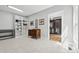 Spacious walk-in closet featuring custom shelves and an antique dresser on neutral tile flooring at 29268 Pennington Rd, Albemarle, NC 28001