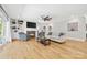 Bright living room featuring hardwood floors, a fireplace, built-in shelving, and neutral paint at 29268 Pennington Rd, Albemarle, NC 28001
