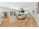 Spacious living room with hardwood floors, fireplace, ceiling fan, and access to outdoor patio at 29268 Pennington Rd, Albemarle, NC 28001