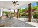 Covered patio featuring exposed brick columns and an outdoor dining set at 29268 Pennington Rd, Albemarle, NC 28001