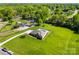 Gorgeous home boasts a private pool, expansive yard, and lush landscaping, creating a perfect retreat in a serene neighborhood at 3003 Eaker Dr, Cherryville, NC 28021