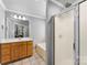 Bright bathroom featuring a double vanity, soaking tub, and glass-enclosed shower at 3003 Eaker Dr, Cherryville, NC 28021