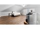Expansive upstairs bedroom with hardwood floors, white walls, and multiple closets at 3003 Eaker Dr, Cherryville, NC 28021