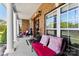 Inviting front porch with classic columns, comfortable seating, and charming decor welcomes you to this beautiful brick home at 3003 Eaker Dr, Cherryville, NC 28021
