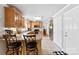 Eat-in kitchen features granite counters, ample cabinetry, and stainless appliances with backyard view, seamlessly flowing into dining area at 3003 Eaker Dr, Cherryville, NC 28021