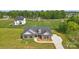 Stunning aerial view of a brick home with a manicured lawn and inviting curb appeal at 3013 Isle Ln, Monroe, NC 28110