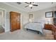 Cozy bedroom featuring a comfortable bed, armoire and neutral tones for a relaxing retreat at 3013 Isle Ln, Monroe, NC 28110