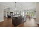 This kitchen offers a central island, stainless steel appliances, and a seamless transition to the dining area at 3013 Isle Ln, Monroe, NC 28110