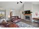 Cozy living room with a stone fireplace, comfortable seating, and elegant decor is the perfect space at 3013 Isle Ln, Monroe, NC 28110