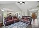 Open-concept living room flows into the kitchen, featuring comfortable seating and elegant decor throughout at 3013 Isle Ln, Monroe, NC 28110